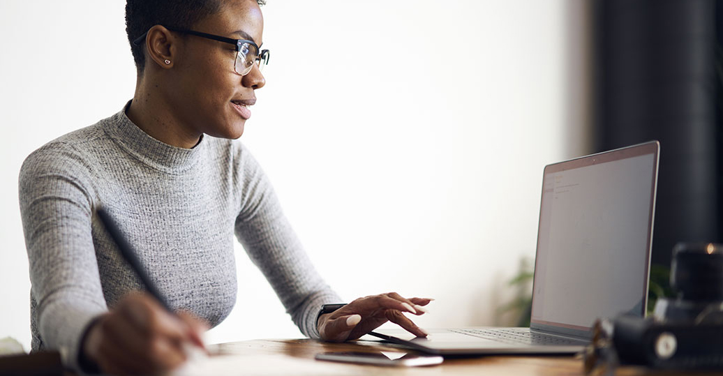 Woman viewing laptop computer