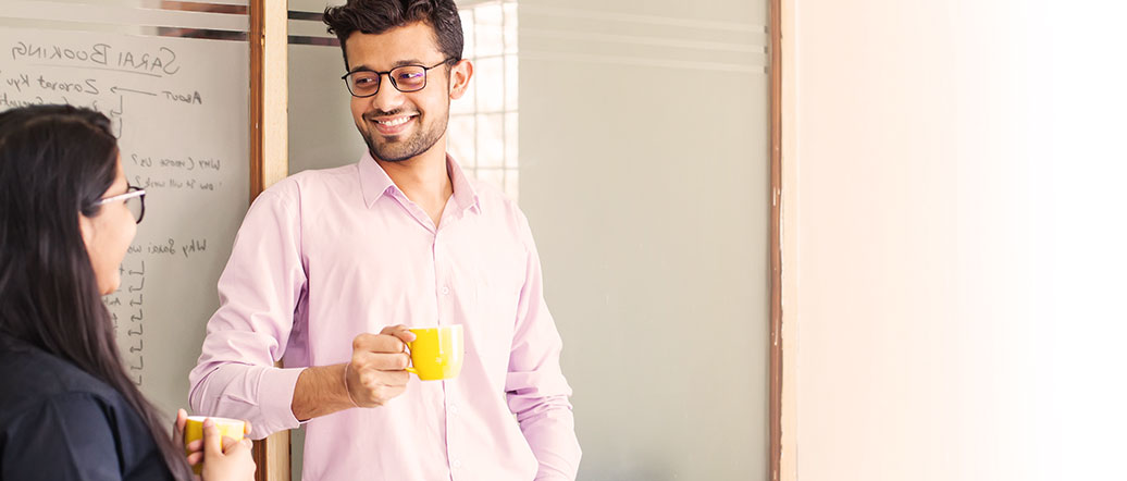 Two people discussing over a cup of coffee