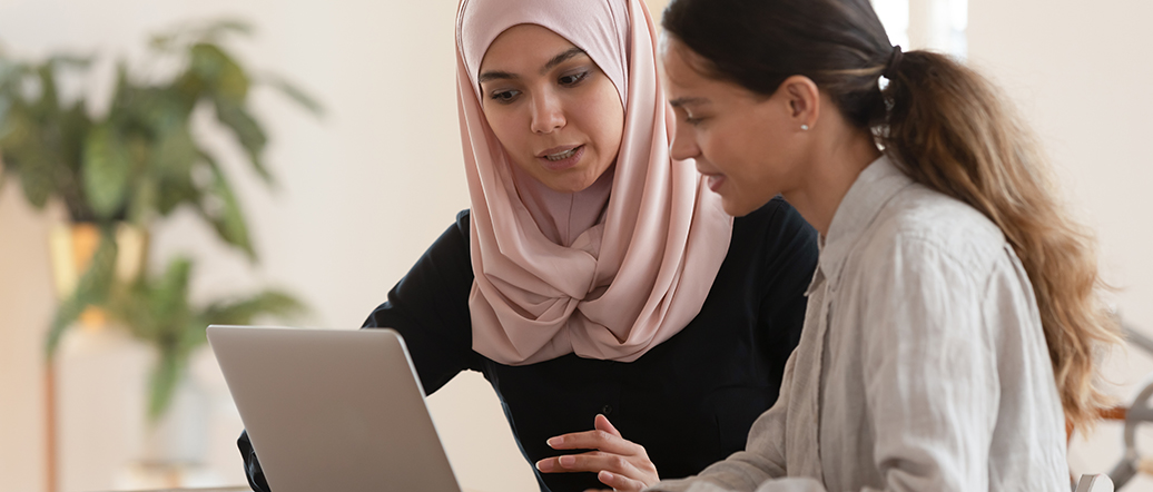 Two women learning at a computer