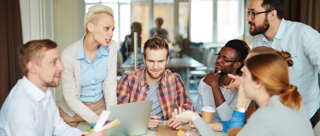 Group of professionals discussing around a table